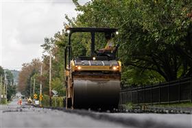 Blooming Glen Contractors: A Caterpillar blacktop roller compacts fresh laid blacktop. 